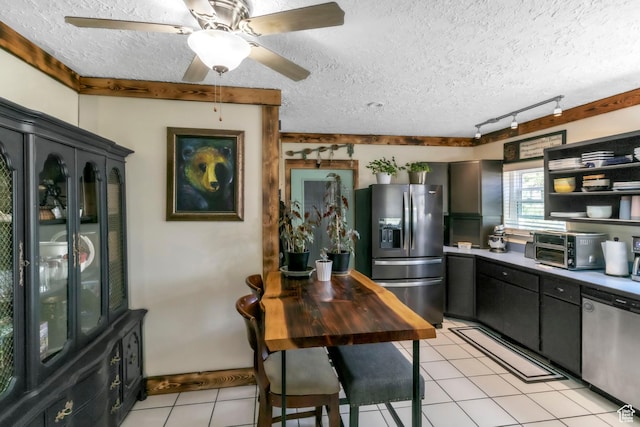 586 W 300 N, Fountain Green, UT 84632 - kitchen with stainless steel appliances, light tile patterned floors, a textured ceiling, rail lighting, and a ceiling fan