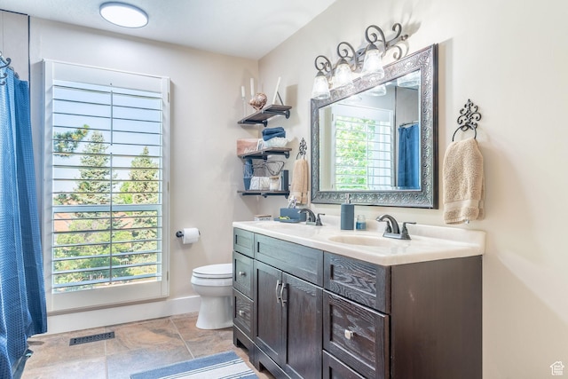 2582 Jacqueline Dr E, Ogden, UT 84403 - full bathroom with toilet and double vanity
