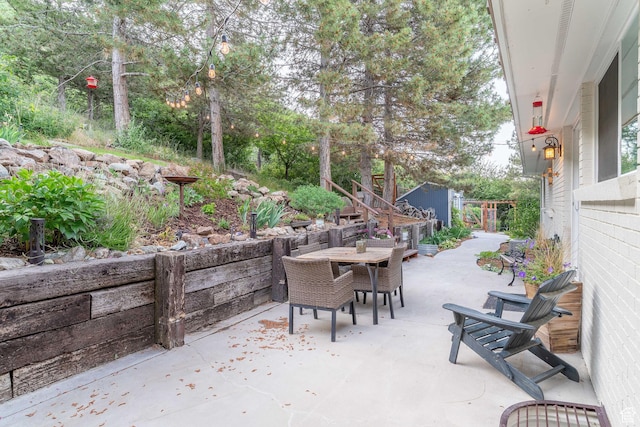 2582 Jacqueline Dr E, Ogden, UT 84403 - view of patio / terrace with outdoor dining space and a storage shed