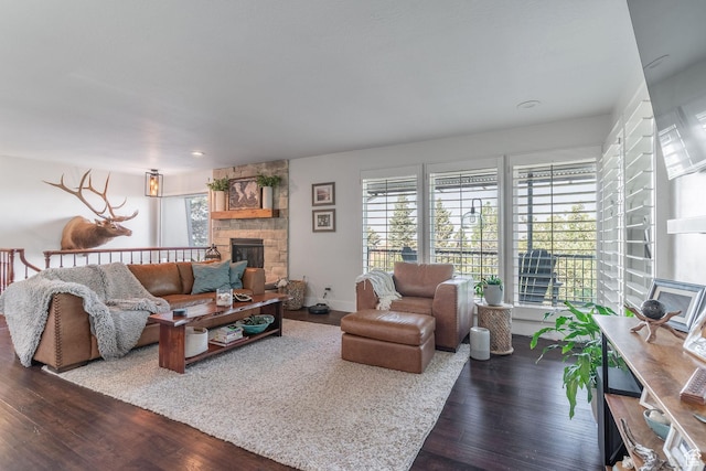 2582 Jacqueline Dr E, Ogden, UT 84403 - living room with a stone fireplace, dark wood-style floors, and recessed lighting