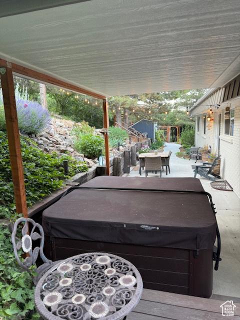 2582 Jacqueline Dr E, Ogden, UT 84403 - view of patio / terrace featuring a hot tub and outdoor dining space