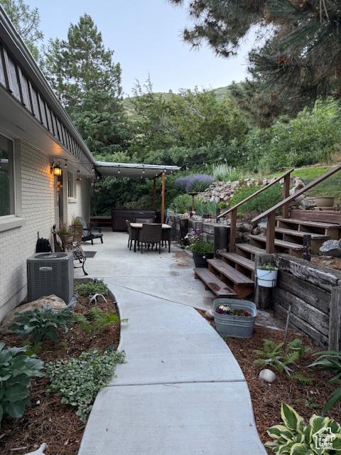 2582 Jacqueline Dr E, Ogden, UT 84403 - view of patio / terrace featuring stairway and outdoor dining space