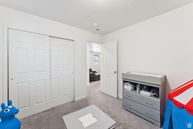 5488 W Tower Arch Ln, Herriman, UT 84096 - bedroom with carpet, a textured ceiling, and a closet