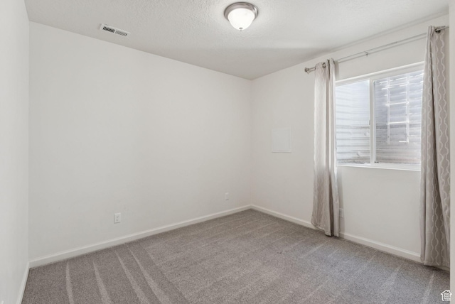 5488 W Tower Arch Ln, Herriman, UT 84096 - spare room with carpet floors and a textured ceiling