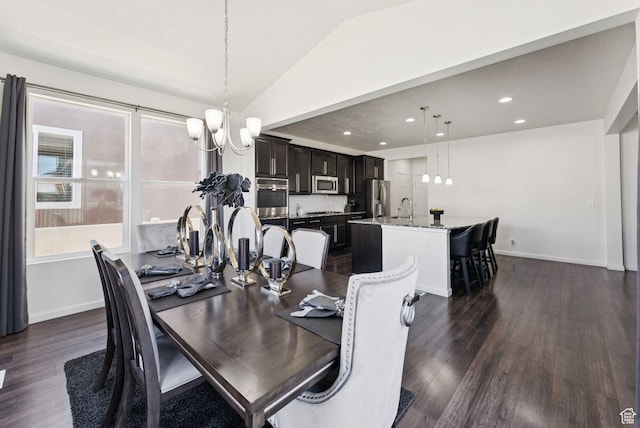 5488 W Tower Arch Ln, Herriman, UT 84096 - dining space with a chandelier, vaulted ceiling, dark wood-type flooring, and recessed lighting