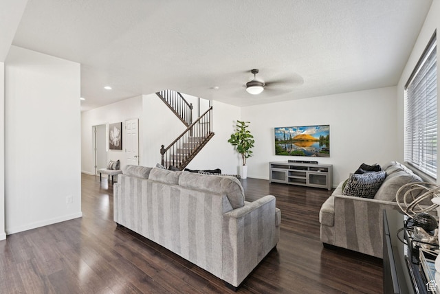 5488 W Tower Arch Ln, Herriman, UT 84096 - living room with dark wood-style floors, stairway, ceiling fan, recessed lighting, and a textured ceiling