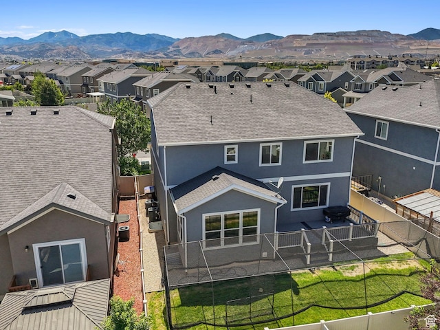 5488 W Tower Arch Ln, Herriman, UT 84096 - back of property with stucco siding, a residential view, and a mountain view