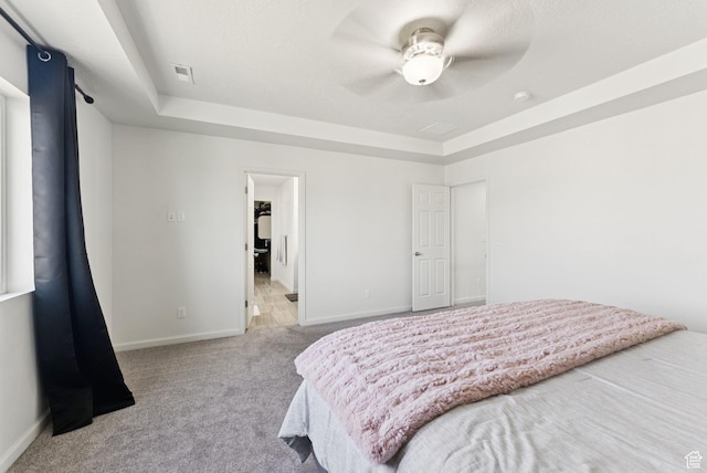 5488 W Tower Arch Ln, Herriman, UT 84096 - carpeted bedroom featuring a raised ceiling and ceiling fan