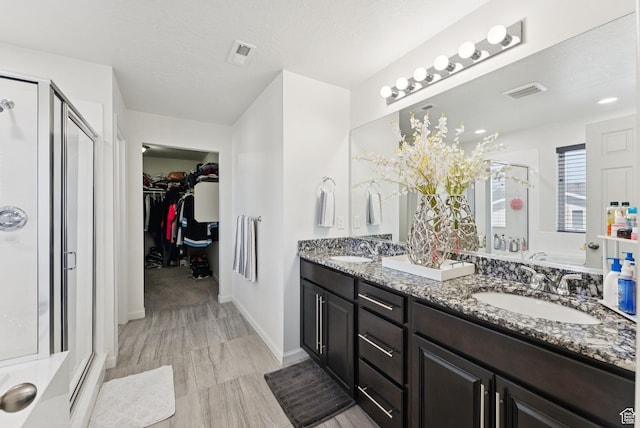 5488 W Tower Arch Ln, Herriman, UT 84096 - full bath with a stall shower, double vanity, and a walk in closet