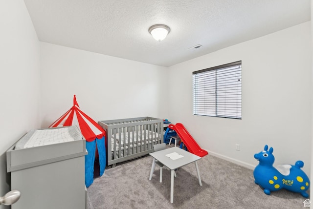 5488 W Tower Arch Ln, Herriman, UT 84096 - bedroom featuring carpet floors, a textured ceiling, and a nursery area