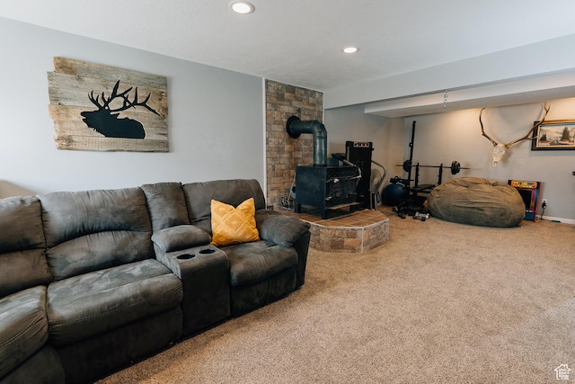 496 S 3rd E, Preston, ID 83263 - carpeted living room featuring a wood stove and recessed lighting