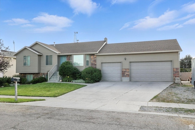 496 S 3rd E, Preston, ID 83263 - ranch-style house with a garage, driveway, a front yard, stone siding, and a shingled roof