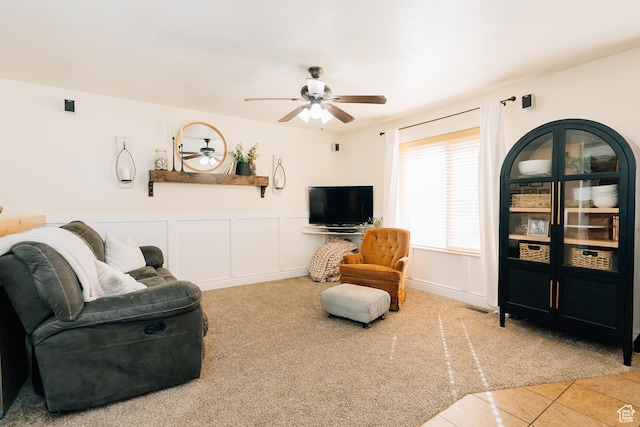 496 S 3rd E, Preston, ID 83263 - tiled living room with carpet floors, a ceiling fan, and wainscoting