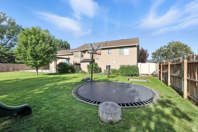 496 S 3rd E, Preston, ID 83263 - rear view of property featuring a trampoline and a fenced backyard