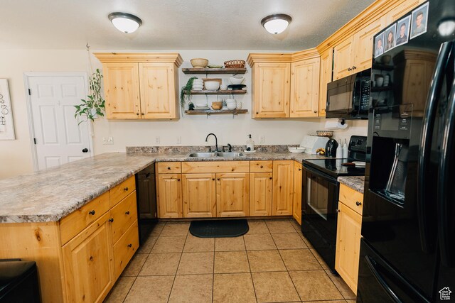 496 S 3rd E, Preston, ID 83263 - kitchen with black appliances, a peninsula, and light brown cabinetry