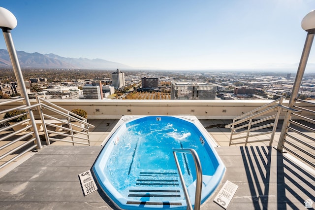 48 W 300 S Unit 903, Salt Lake City, UT 84101 - view of swimming pool with a city view, a mountain view, and a hot tub