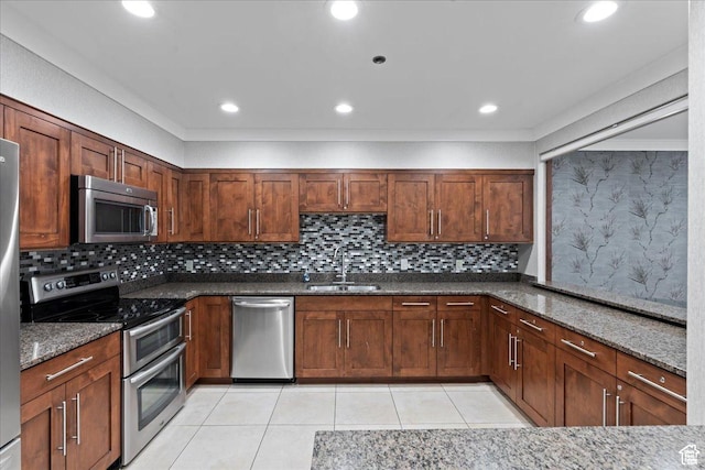 48 W 300 S Unit 903, Salt Lake City, UT 84101 - kitchen with stainless steel appliances, dark stone countertops, light tile patterned floors, decorative backsplash, and recessed lighting