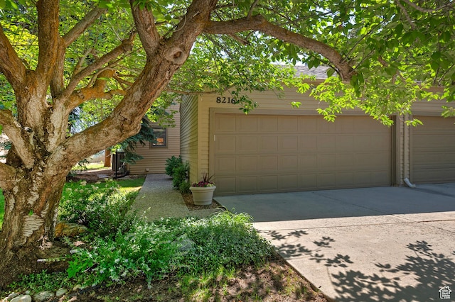 8216 S Scandia Way, Sandy, UT 84093 - garage featuring driveway