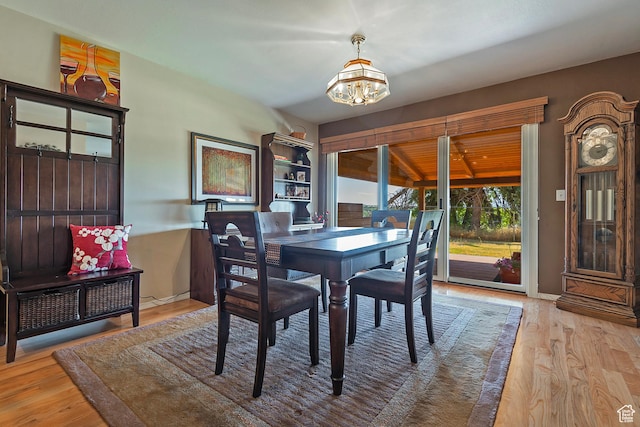 8216 S Scandia Way, Sandy, UT 84093 - dining space with a chandelier and wood finished floors