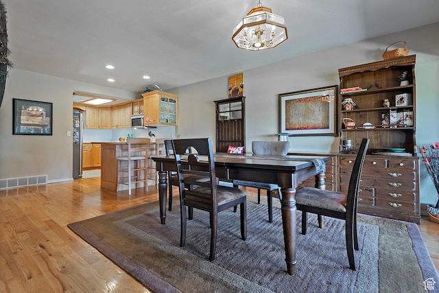 8216 S Scandia Way, Sandy, UT 84093 - dining area featuring light wood-style floors, recessed lighting, and a chandelier