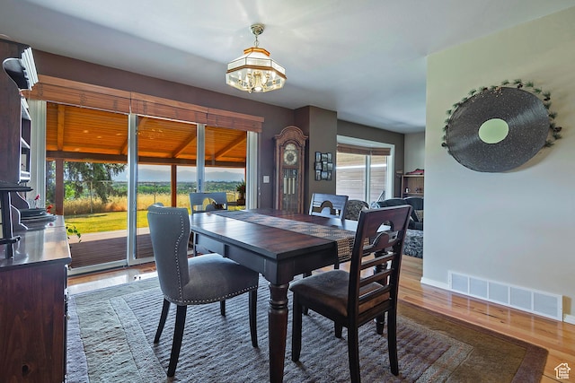 8216 S Scandia Way, Sandy, UT 84093 - dining area with a chandelier and wood finished floors