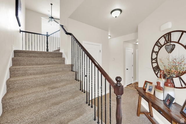 3951 W Sage Blossom Way S, Jordan, UT 84009 - stairs with ceiling fan and carpet floors