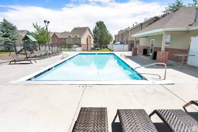3951 W Sage Blossom Way S, Jordan, UT 84009 - community pool featuring a residential view and a patio area
