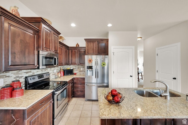 3951 W Sage Blossom Way S, Jordan, UT 84009 - kitchen featuring stainless steel appliances, light tile patterned flooring, tasteful backsplash, light stone countertops, and dark brown cabinetry