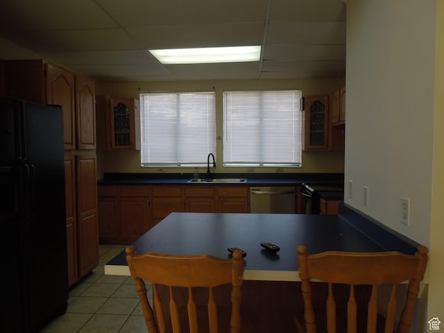426 N Amber Ln N Unit 426, Castle Valley, UT 84532 - kitchen featuring freestanding refrigerator, stainless steel dishwasher, a breakfast bar, a drop ceiling, and a peninsula