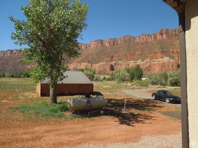 426 N Amber Ln N Unit 426, Castle Valley, UT 84532 - view of yard with a mountain view, a pole building, and an outbuilding