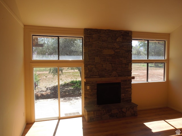 426 N Amber Ln N Unit 426, Castle Valley, UT 84532 - unfurnished living room with wood finished floors and a stone fireplace