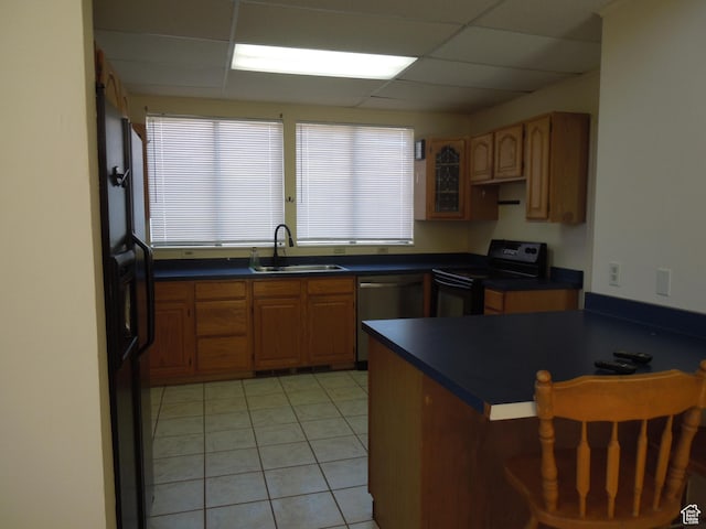 426 N Amber Ln N Unit 426, Castle Valley, UT 84532 - kitchen with black electric range oven, dishwasher, dark countertops, a drop ceiling, and a kitchen breakfast bar