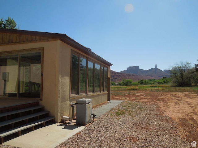 426 N Amber Ln N Unit 426, Castle Valley, UT 84532 - view of yard with a sunroom and a mountain view