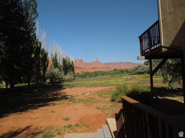 426 N Amber Ln N Unit 426, Castle Valley, UT 84532 - view of yard with a view of countryside and a deck with mountain view
