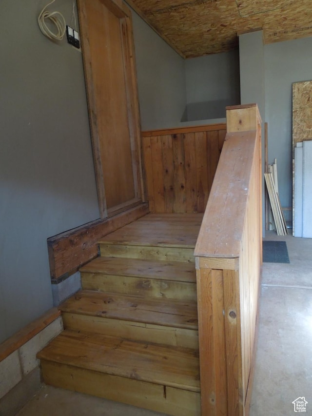 426 N Amber Ln N Unit 426, Castle Valley, UT 84532 - stairs with wood walls, concrete flooring, and wainscoting
