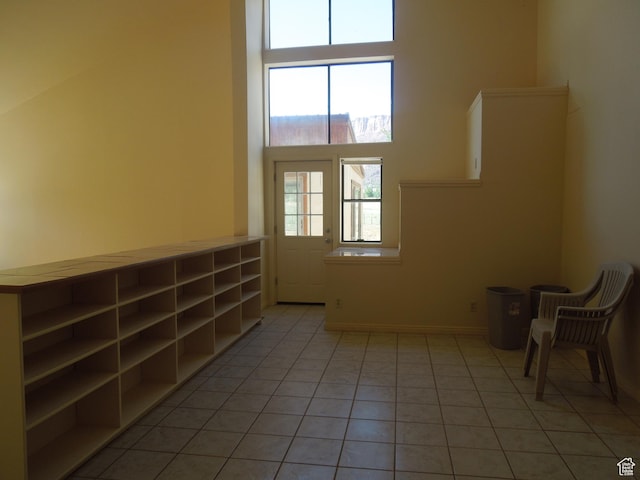 426 N Amber Ln N Unit 426, Castle Valley, UT 84532 - unfurnished room with light tile patterned floors and a high ceiling