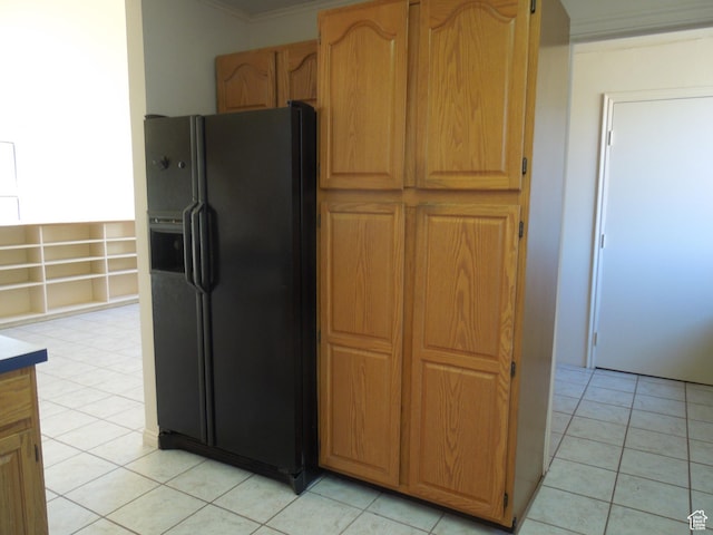 426 N Amber Ln N Unit 426, Castle Valley, UT 84532 - kitchen featuring black fridge, light tile patterned floors, and crown molding