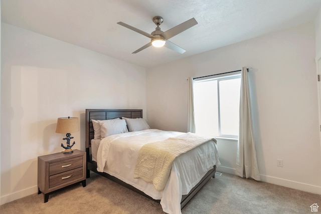 248 W Chukar Cir Unit 18, Garden City, UT 84028 - bedroom with light carpet and ceiling fan