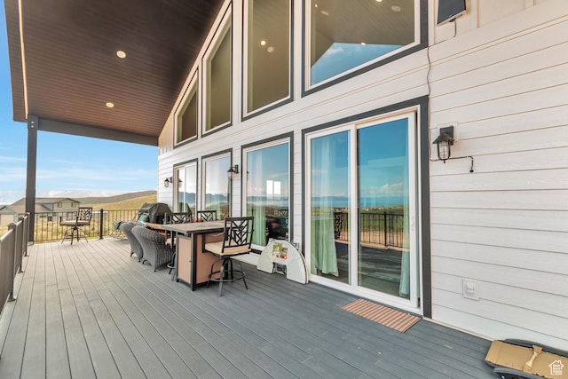 248 W Chukar Cir Unit 18, Garden City, UT 84028 - wooden terrace with outdoor dining area