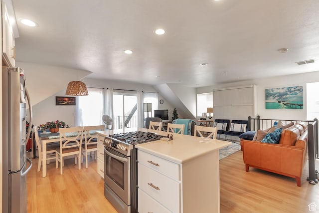 248 W Chukar Cir Unit 18, Garden City, UT 84028 - kitchen featuring stainless steel appliances, light wood-style floors, white cabinets, recessed lighting, and open floor plan