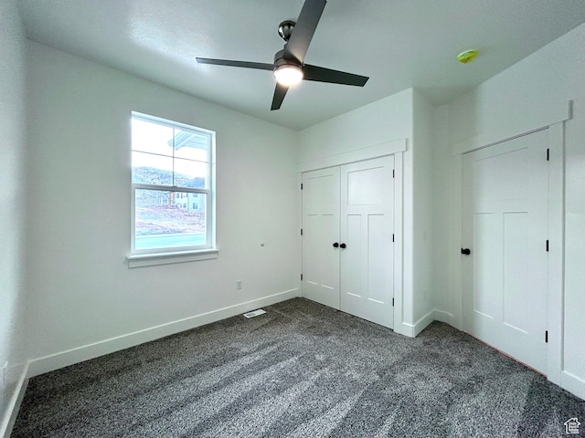 82 N 500 W, Gunnison, UT 84634 - unfurnished bedroom featuring dark colored carpet, a closet, and ceiling fan