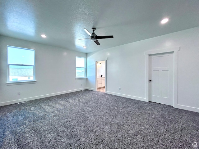 82 N 500 W, Gunnison, UT 84634 - unfurnished bedroom with multiple windows, carpet flooring, recessed lighting, ceiling fan, and connected bathroom