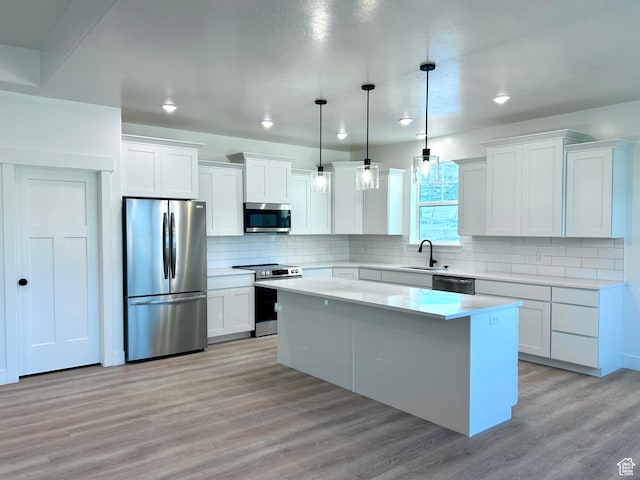 82 N 500 W, Gunnison, UT 84634 - kitchen featuring appliances with stainless steel finishes, a center island, white cabinets, light countertops, and recessed lighting