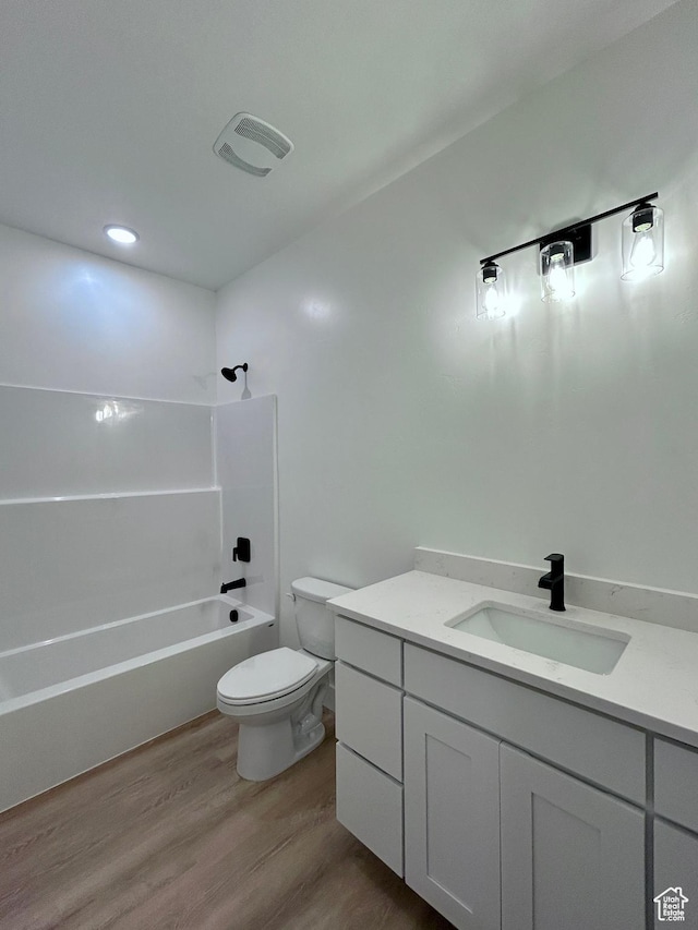 82 N 500 W, Gunnison, UT 84634 - bathroom with vanity, wood finished floors, and washtub / shower combination