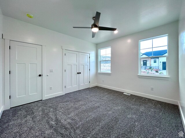 82 N 500 W, Gunnison, UT 84634 - unfurnished bedroom featuring dark colored carpet and a ceiling fan