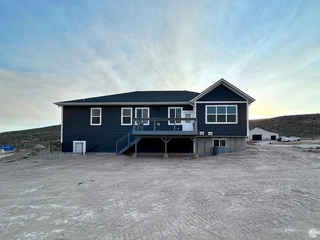 82 N 500 W, Gunnison, UT 84634 - back of property at dusk with a wooden deck and stairway