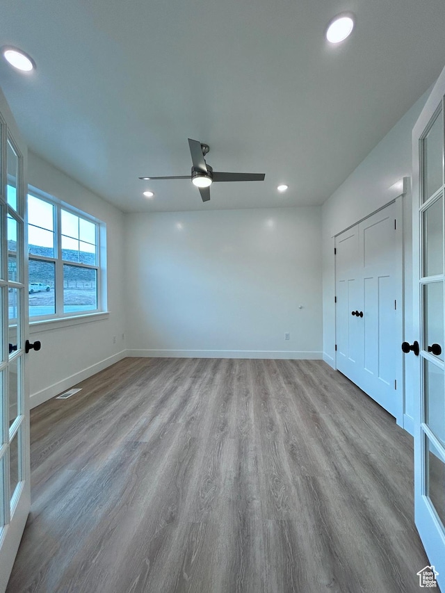 82 N 500 W, Gunnison, UT 84634 - unfurnished bedroom with wood finished floors, recessed lighting, a ceiling fan, and french doors