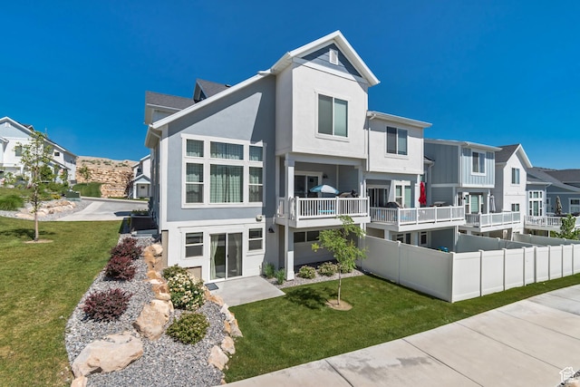 9757 N Aaron Ave E Unit 204, Eagle Mountain, UT 84005 - view of front facade with stucco siding, a residential view, and a front yard