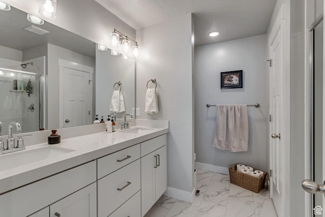 9757 N Aaron Ave E Unit 204, Eagle Mountain, UT 84005 - bathroom featuring marble look tile flooring, double vanity, a shower stall, and recessed lighting
