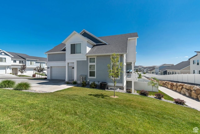 9757 N Aaron Ave E Unit 204, Eagle Mountain, UT 84005 - view of front facade with an attached garage, concrete driveway, a residential view, and stucco siding
